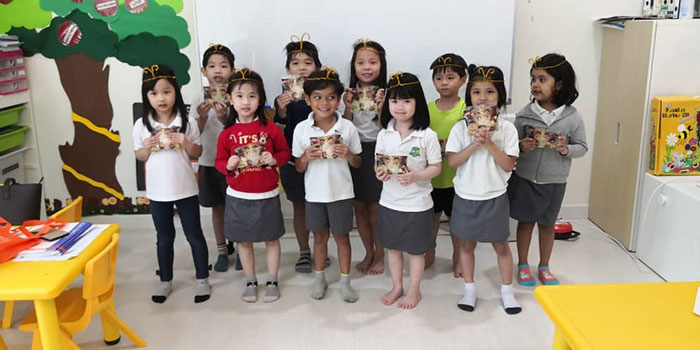 Kids at The Parenthood preschool with their Lego polybags and Monkey King-inspired crowns