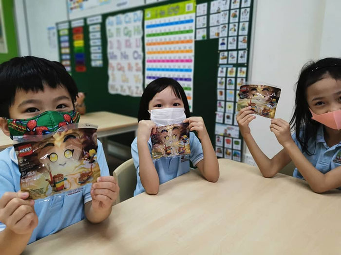 Students at Little Oak Tree with their LEGO Monkey King polybags