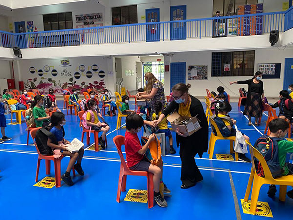 Teachers distributing LEGO Monkey King polybags in Beaconhouse Sri Inai and Beyond Kids